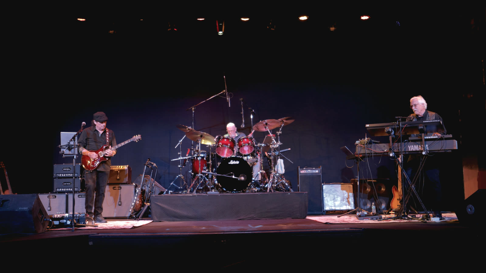 Dreams on stage: Allen on guitar at left, Ed on drums, and Rico at the keyboards on the right.